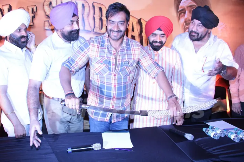 Bollywood actor Ajay Devgan with Congress leader Charan Singh Sapra and other members of Punjabi Cultural Heritage Board (PCHB) at Son Of Sardaar press meet to resolve issues with Sikh Community leaders at Hotel Novotel in Juhu, Mumbai.