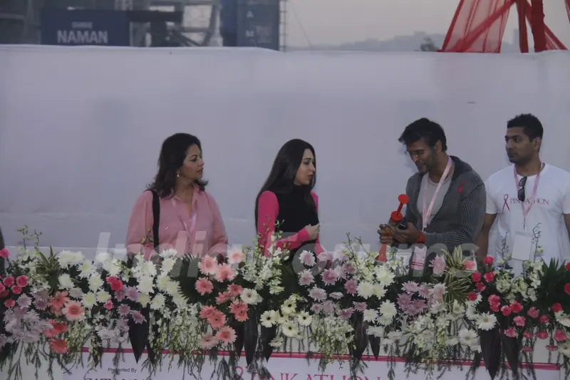 (L to R) Devika Bhojwani, bollywood actors Karisma Kapoor and Milind Soman at the first edition of Pinkathon International 10k women's run for breast cancer awareness at Bandra Kurla Complex in Mumbai.
