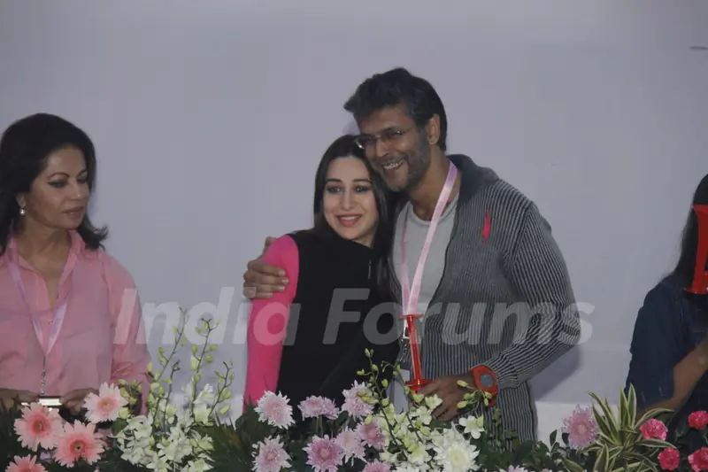 (L to R) Devika Bhojwani, bollywood actors Karisma Kapoor and Milind Soman at the first edition of Pinkathon International 10k women's run for breast cancer awareness at Bandra Kurla Complex in Mumbai.