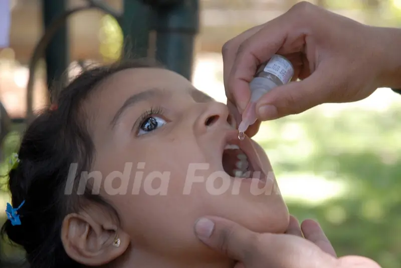 Volunteers administering polio drops to children as part of nationwide pulse polio Immunization programme , in Bangalore on Sunday 24th of February 2013 photo by IANS.