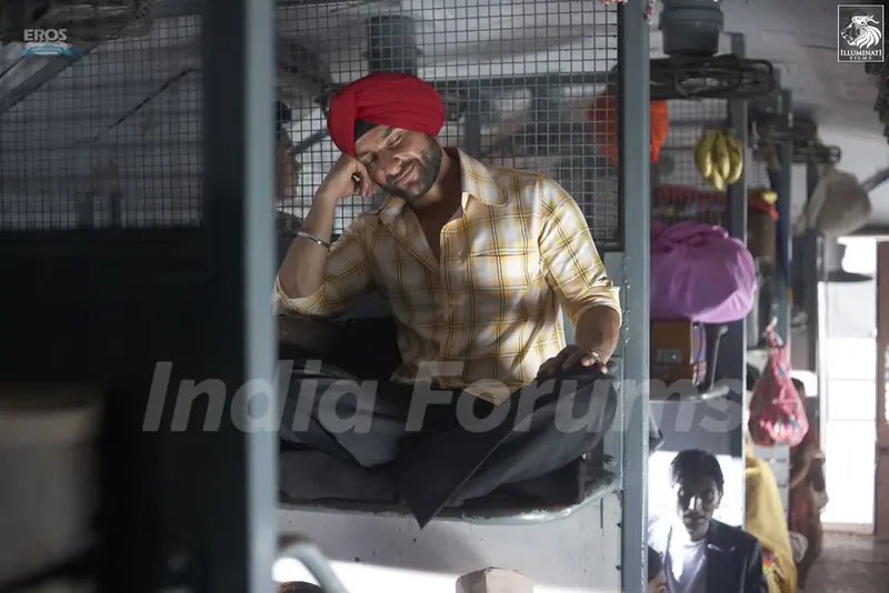 Saif Ali Khan sitting on a train