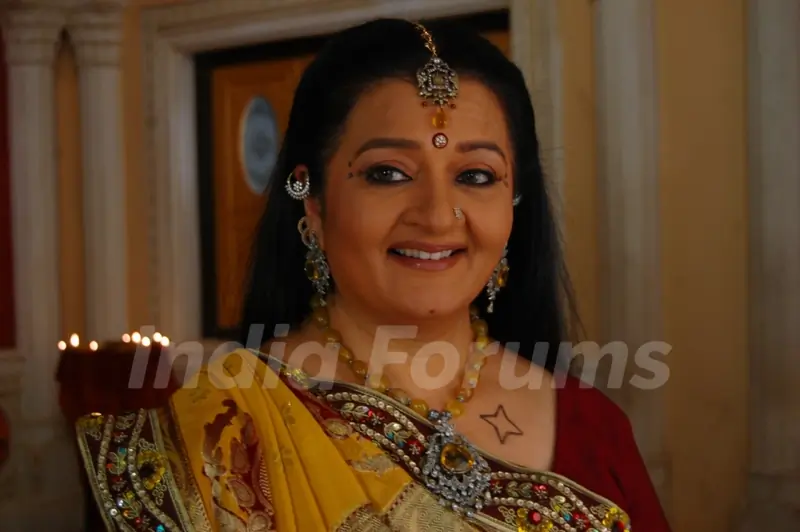A still image of Apra mehta as Jhumki Bua