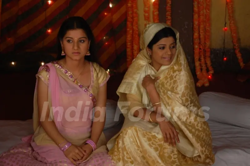 Rani sitting with her Amma