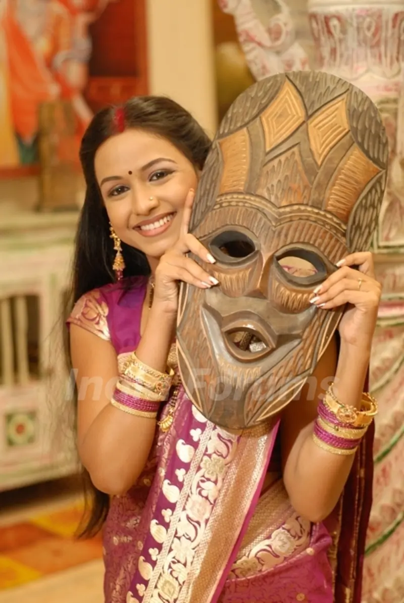 Shree with a wooden mask