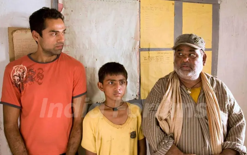 A still image of Abhay Deol and Satish Kaushik