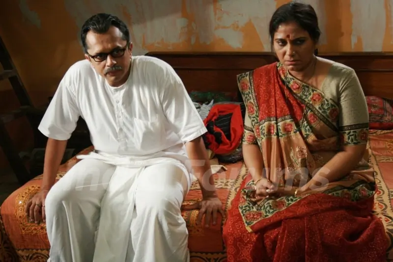 Mohan sitting with Sarla