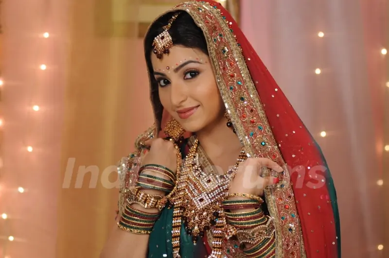 Baby looking beautiful in bridal wear