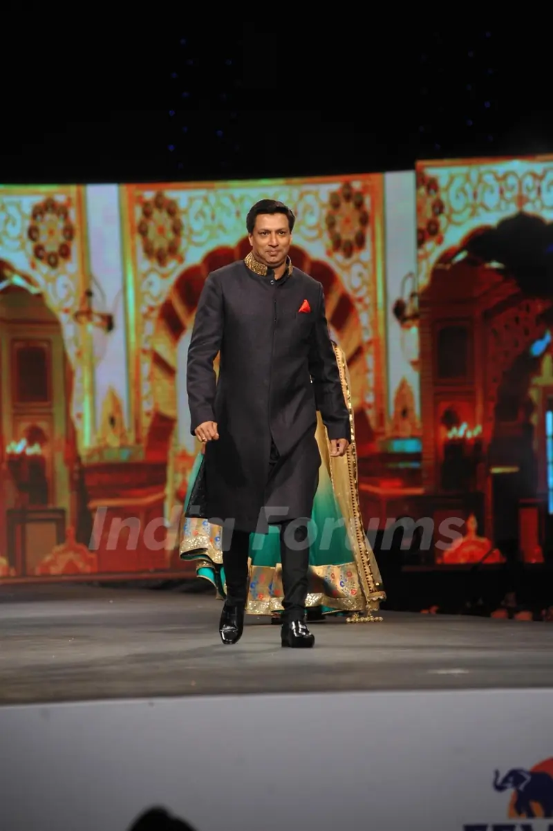 Madhur Bhandarkar walked the ramp at the 'Caring with Style' fashion show at NSCI