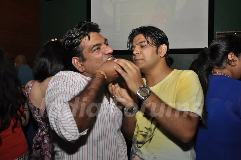 Ankit Tiwari feeding cake to Sujit Tiwari