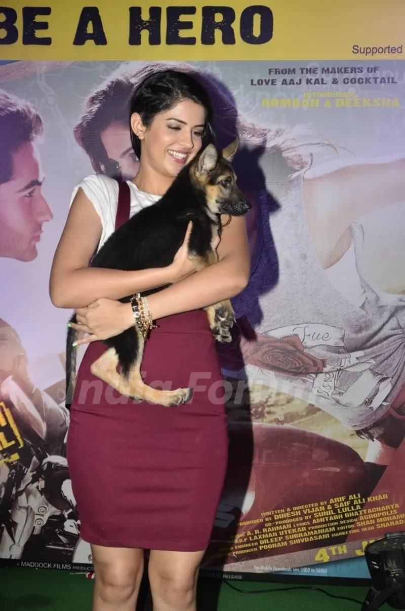 Deeksha Seth holds a puppy