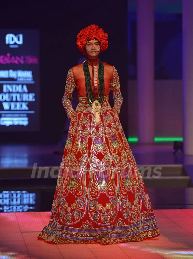 A model walks the ramp at the Indian Couture Week - Day 4