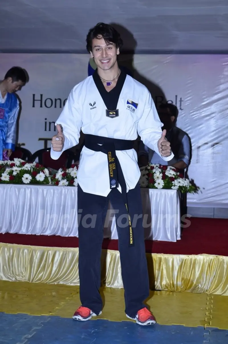 Tiger Shroff gives a thumbs up pose for the camera