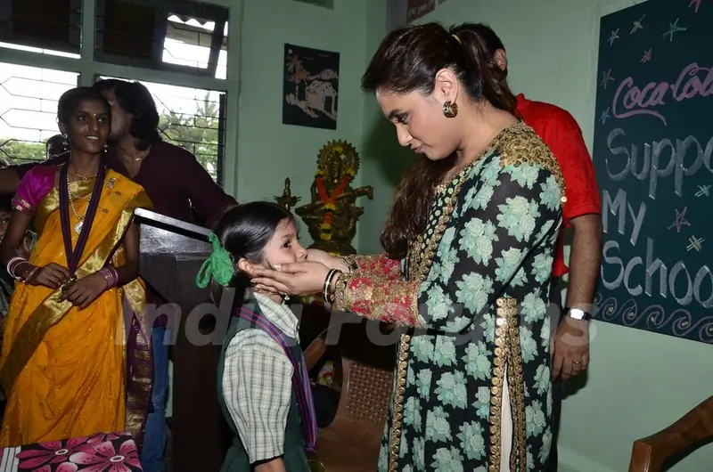 Rani Mukherjee meets a young fan at a Local School