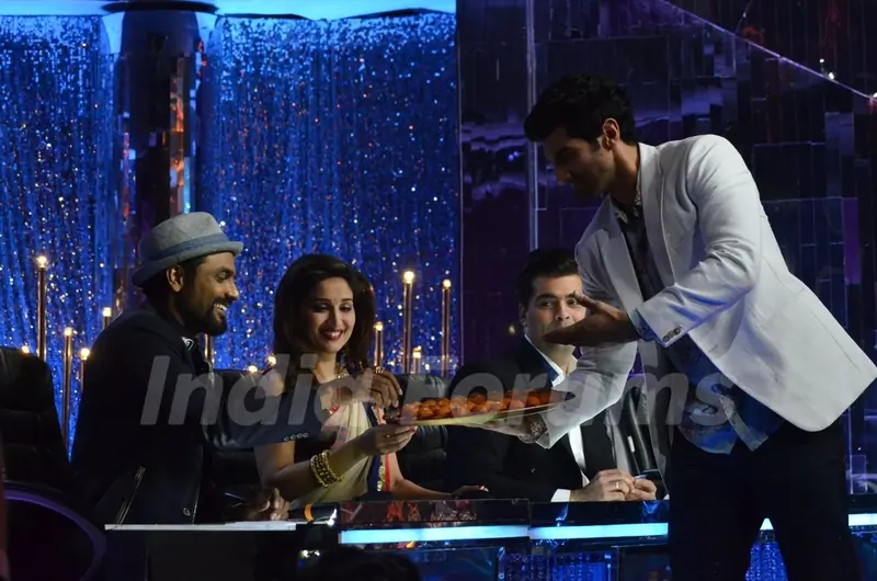 Aditya Roy Kapur distributes sweets to the Judges on Jhalak Dikhhlaa Jaa