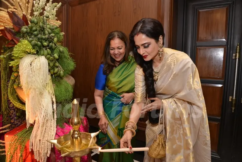 Rekha lighting the lamp at the Sahachari Foundations Show for Tarun Tahiliani