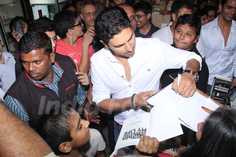 Yuvraj Singh autographs Vikram Sathye's Book at the Launch