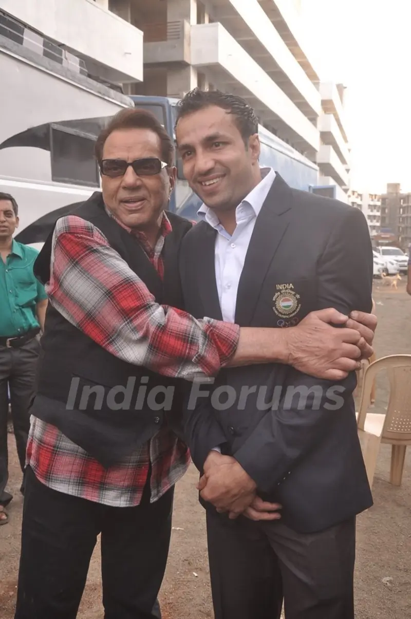 Dharmendra Singh Deol poses with a friend at the Music Launch of Badlapur Boys