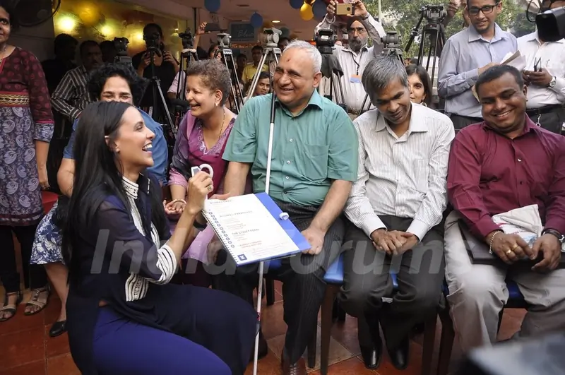 Neha Dhupia interacts with a guest at the Brailler Menu Launch