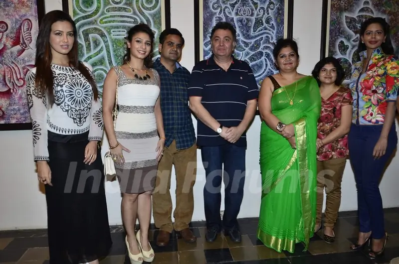 Celebs pose for the media at a Special Art Show Preview