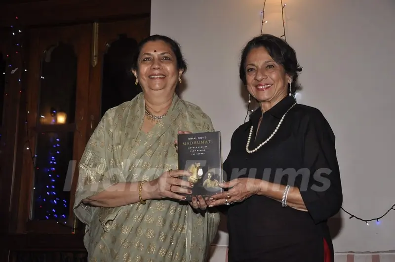 Tanuja poses with Bimal Roy's Book at the Launch
