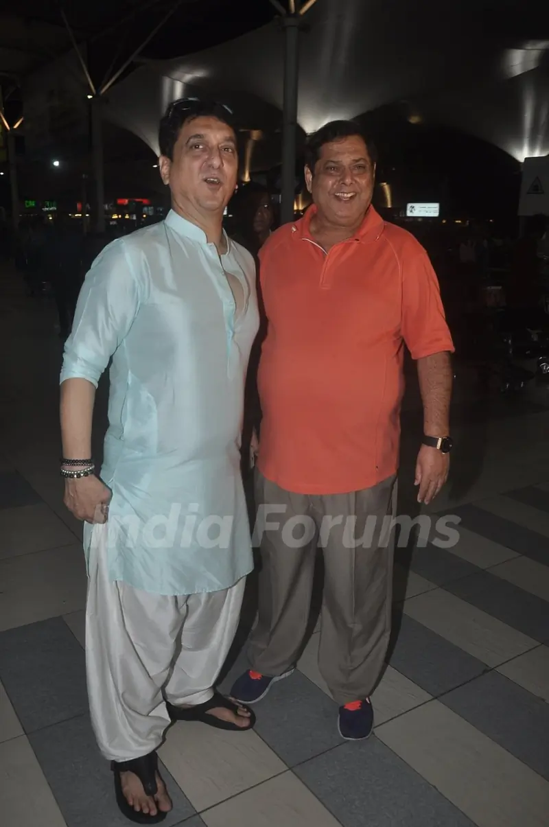 Sajid Nadiadwala and David Dhawan pose at airport while returning from Arpita Khan's Wedding
