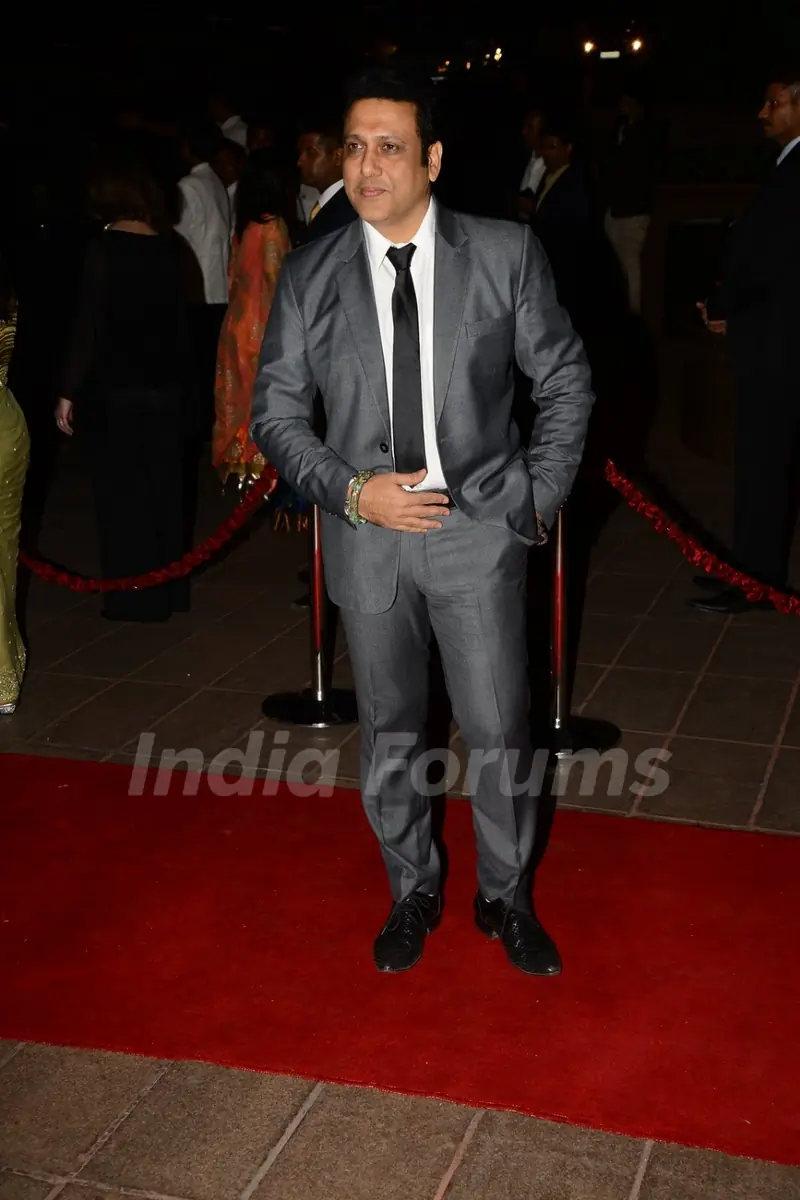 Govinda poses for the media at Arpita Khan's Wedding Reception