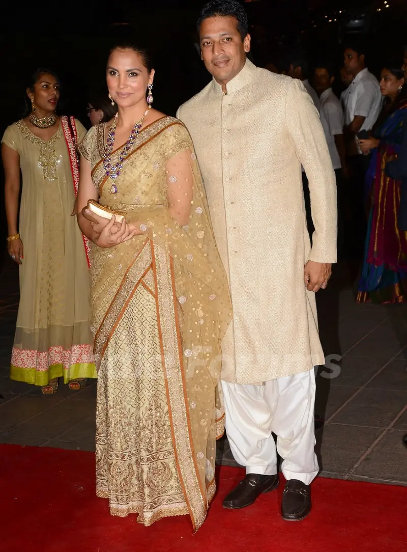 Lara Dutta and Mahesh Bhupathi pose for the media at Arpita Khan's Wedding Reception