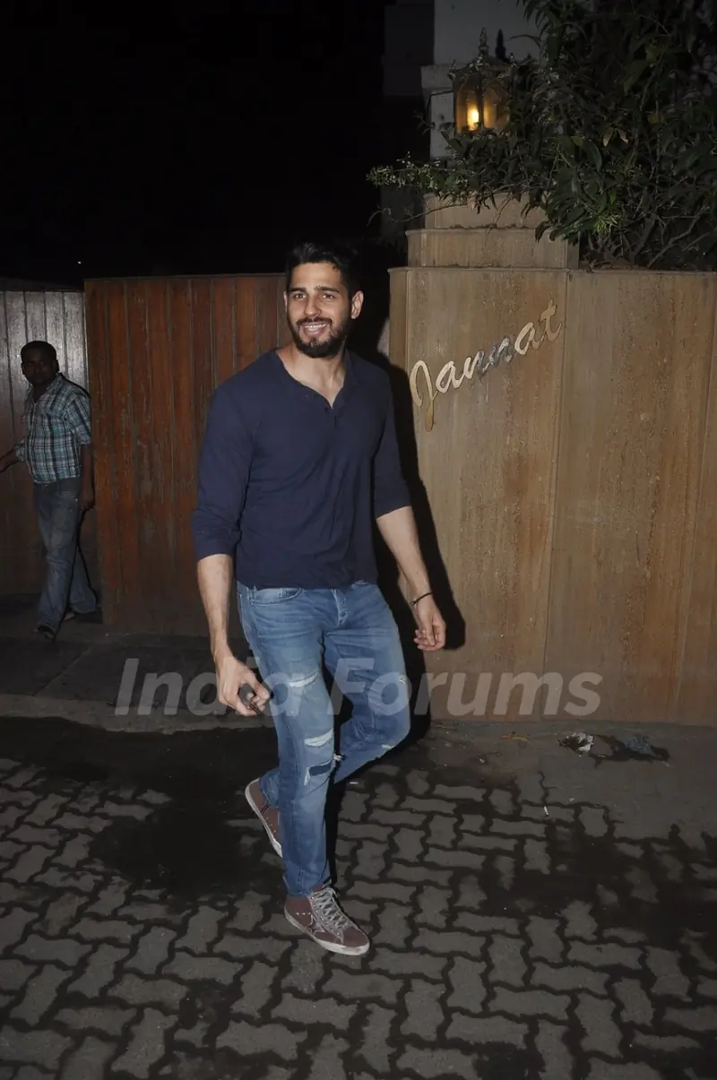Sidharth Malhotra poses for the media at Shaad Randhawa's Party