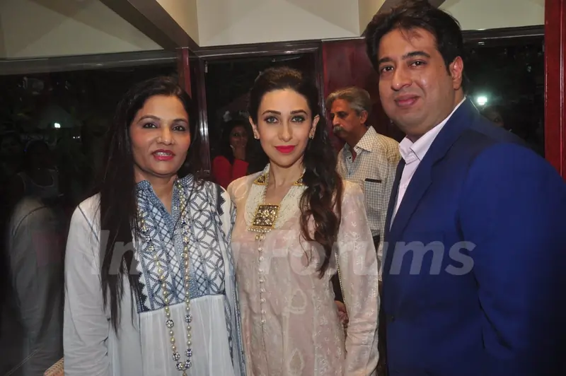 Karisma Kapoor poses with guests at Notandas Jewelers New Collection Launch