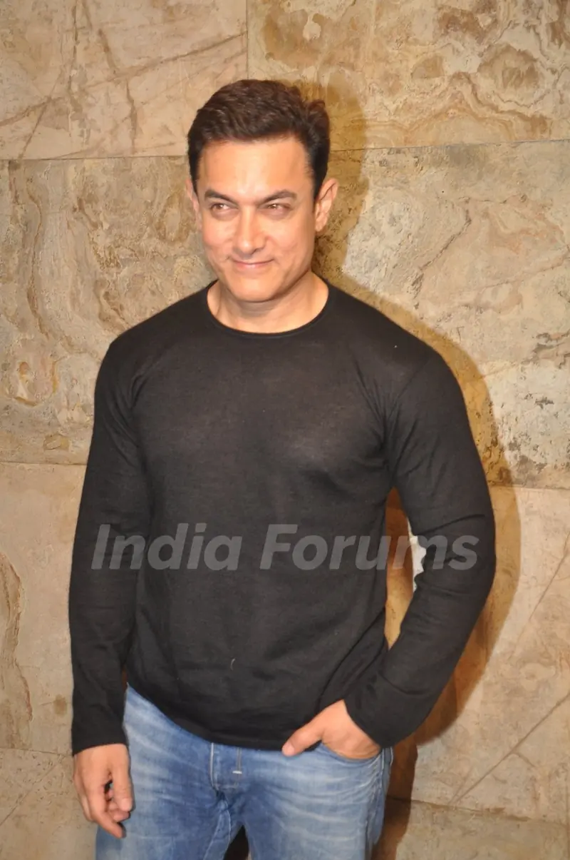 Aamir Khan poses for the media at the Special Screening of P.K. for Sanjay Dutt