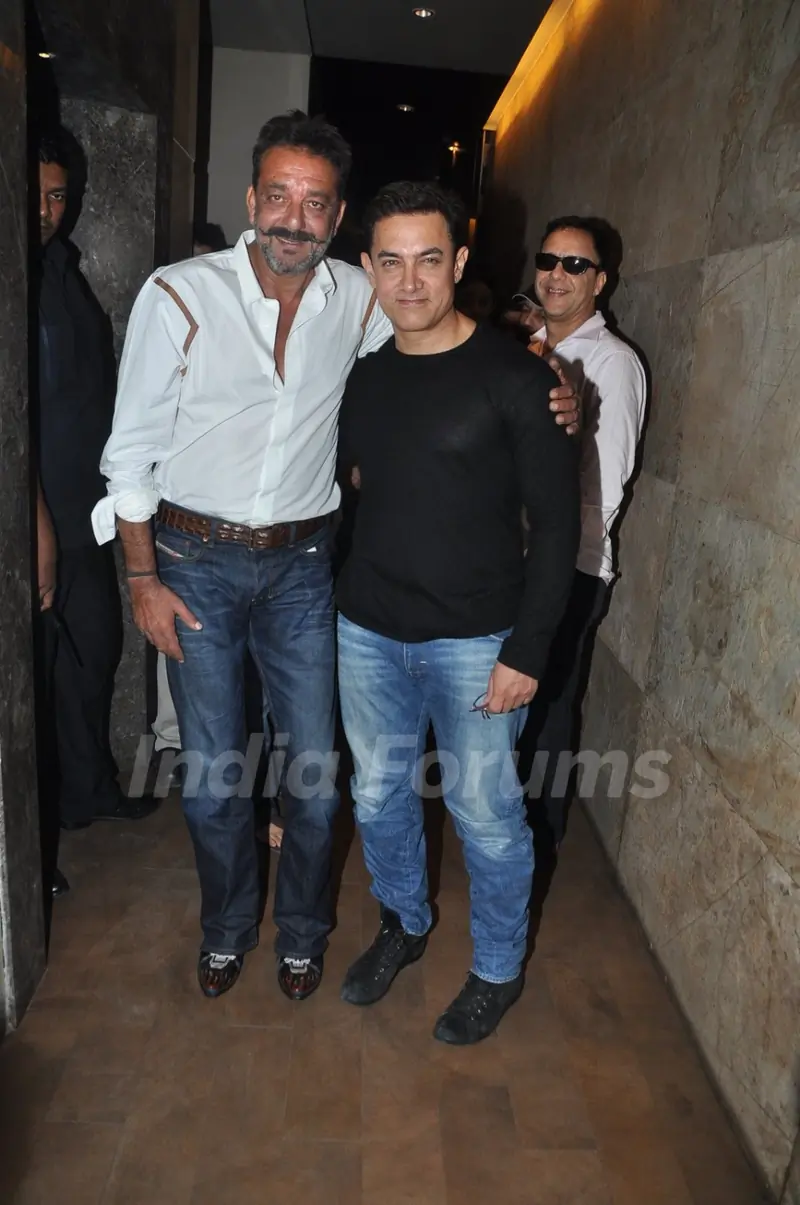 Aamir Khan and Sanjay Dutt pose for the media at the Special Screening of P.K.