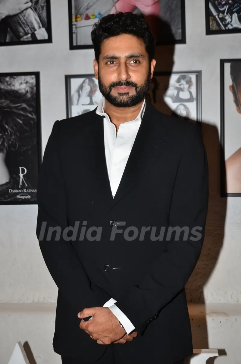 Abhishek Bachchan poses for the media at Dabboo Ratnani's Calendar Launch