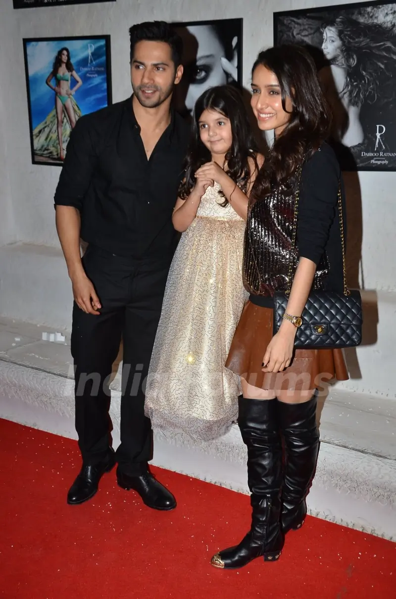 Varun Dhawan and Shraddha Kapoor pose with Dabboo Ratnani's daughter at the Calendar Launch