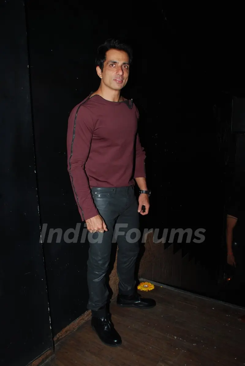 Sonu Sood poses for the media at Kamaal Rashid Khan's Birthday Bash
