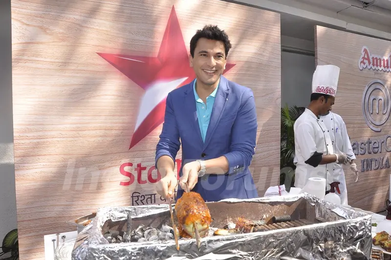 Vikas Khanna prepares a dish at the Launch of Master Chef Season 4