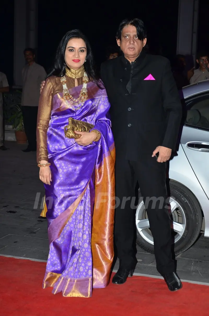 Padmini Kolhapure poses with husband at Kush Sinha's Wedding Reception
