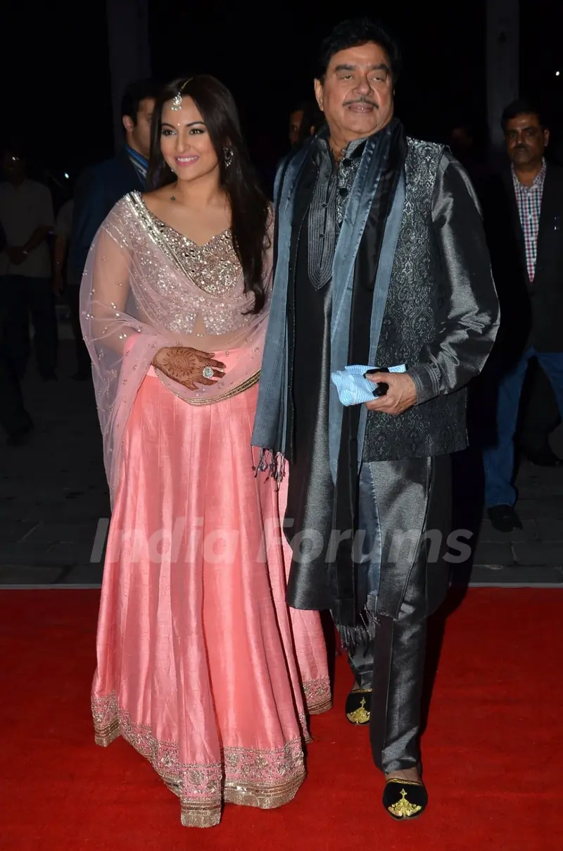 Shatrughan Sinha poses with daughter Sonakshi Sinha at the Wedding Reception of Son Kush Sinha