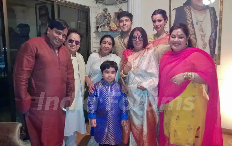 Celebs pose for the media at Bappi Lahiri's Saraswati Pooja