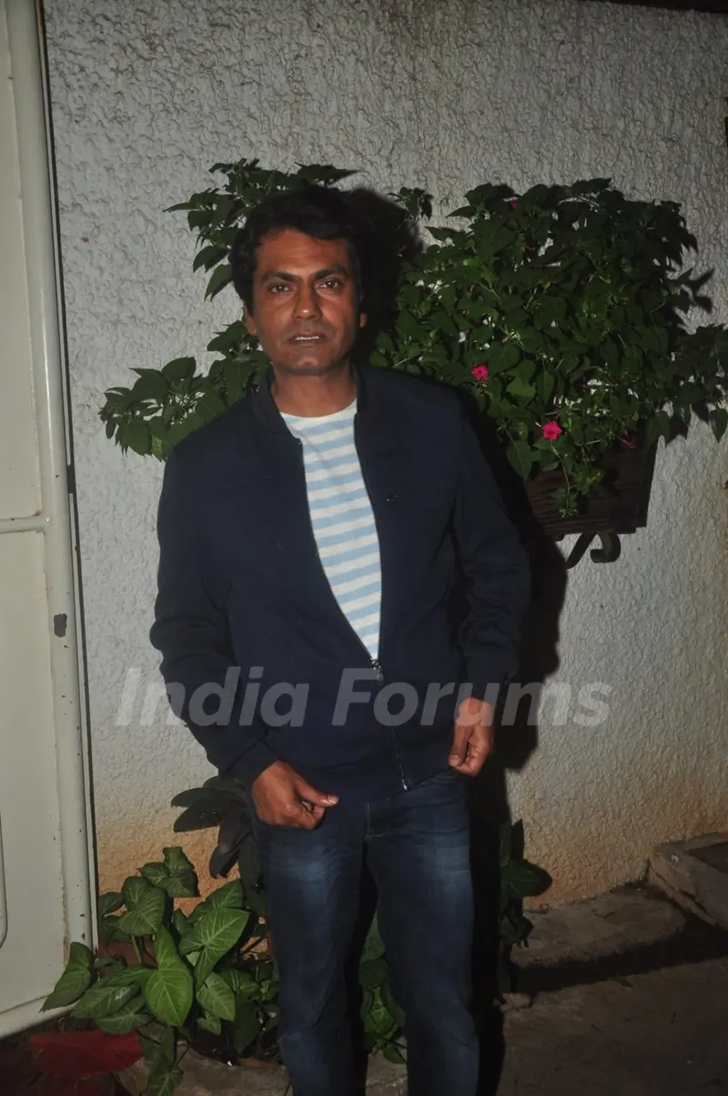 Nawazuddin Siddiqui poses for the media at the Special Screening of Badlapur
