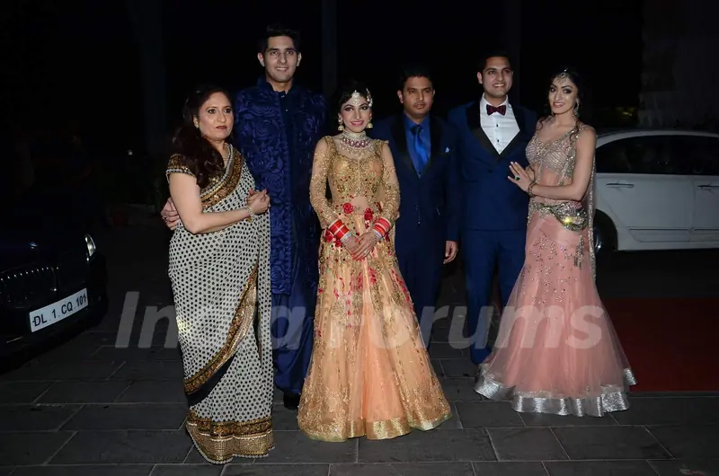 Tulsi Kumar poses with her family members at her Wedding Reception