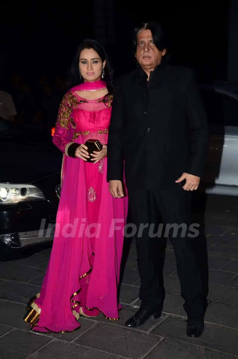 Padmini Kolhapure poses with husband at Tulsi Kumar's Wedding Reception