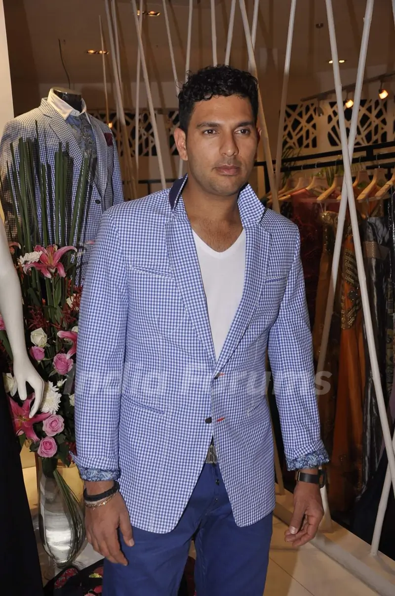 Yuvraj Singh poses for the media at Narendra Kumar's Store Launch