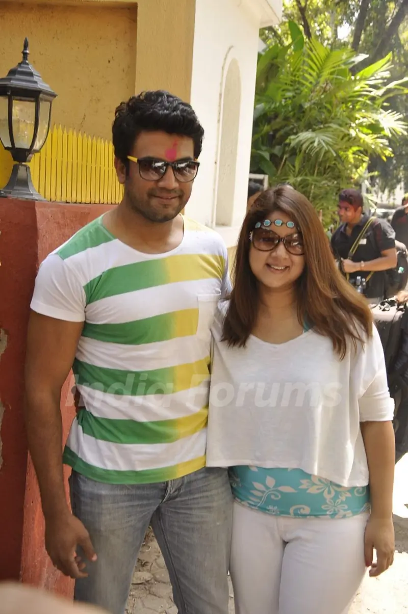Sharad Kelkar and Keerti Gaekwad Kelkar pose for the media at Shabana Azmi's Holi Bash