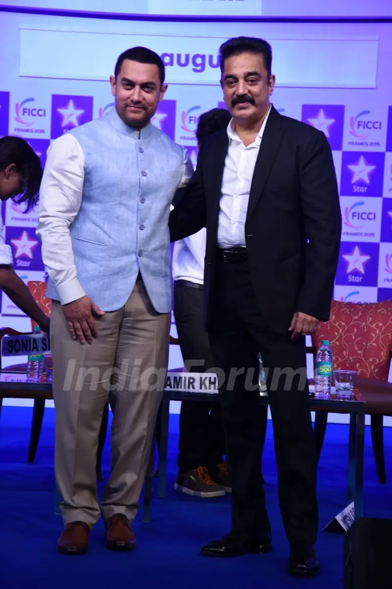 Aamir Khan and Kamal Haasan pose for the media at FICCI Frames 2015 Inaugural Session