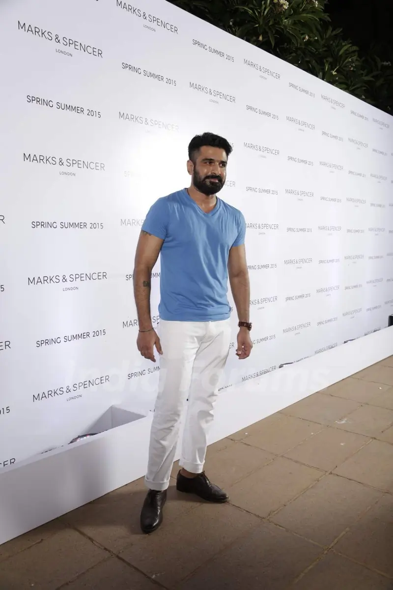Eijaz Khan poses for the media at Marks & Spencers Spring/Summer 2015 Collection Launch