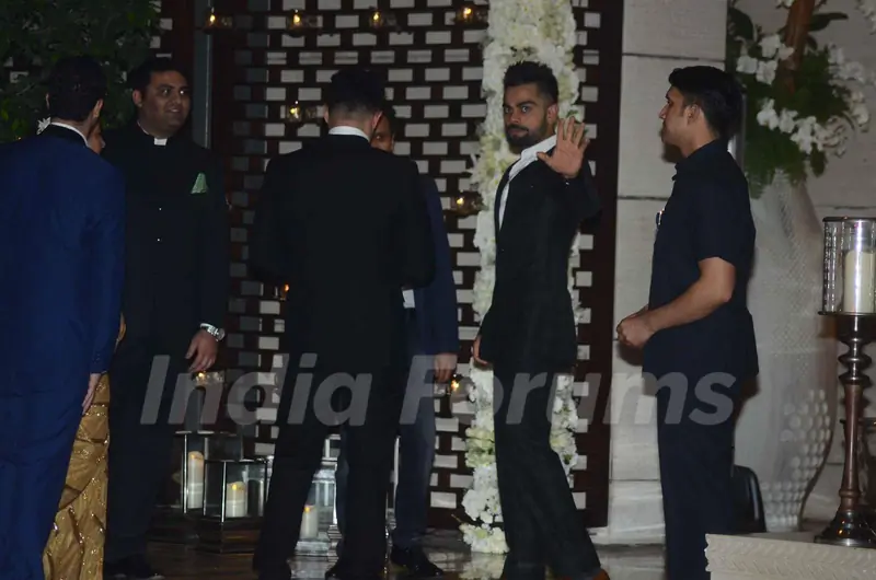 Virat Khohli waves to the media at Mukesh and Nita Ambani's Bash