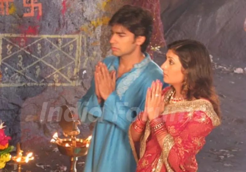 Sumit and Kumkum praying to God
