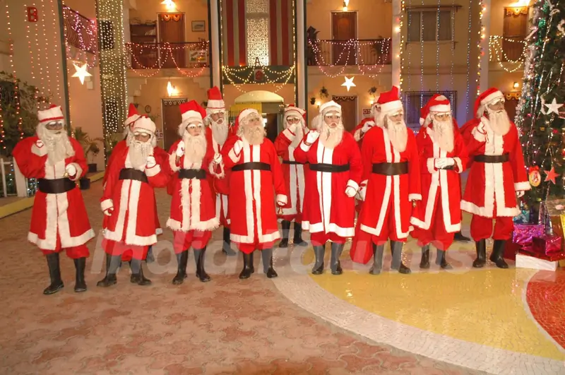 All cast dressed as SantaClaus