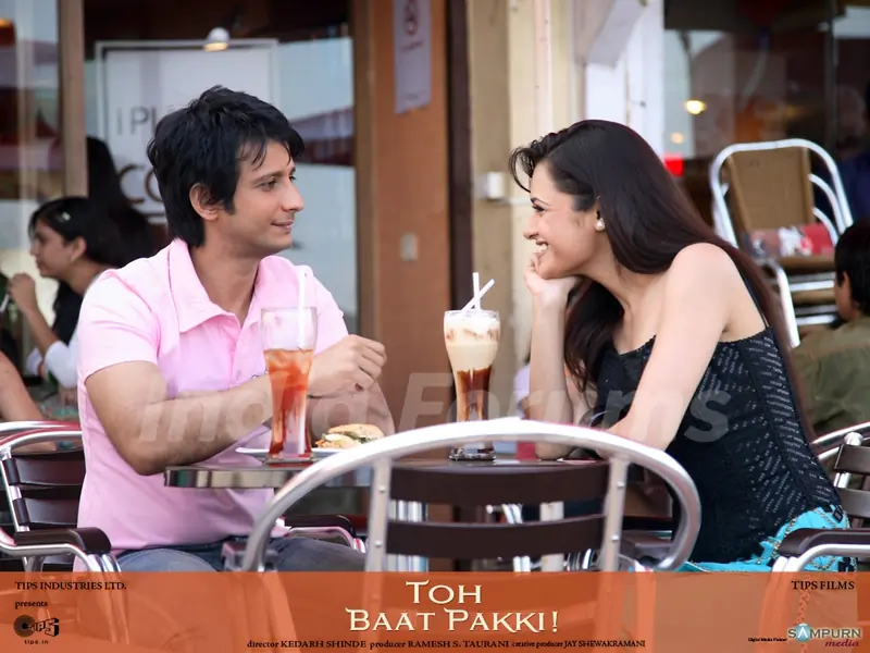 Sharman and Yuvika sitting in coffee shop