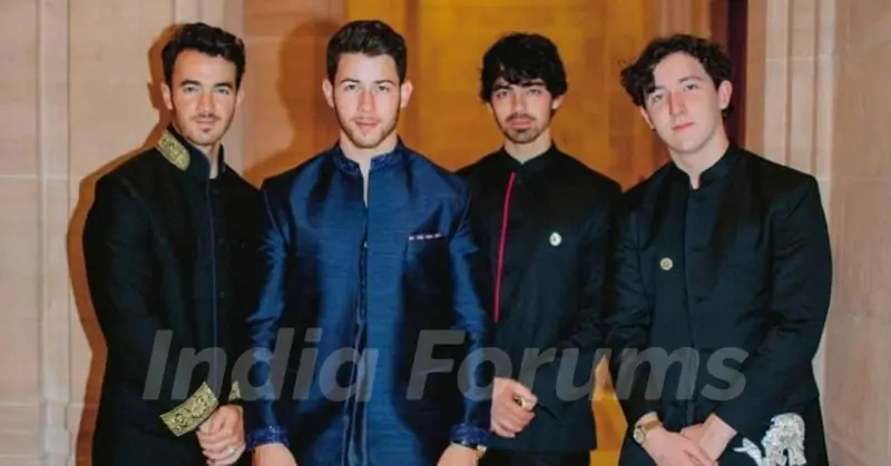 Nick Jonas with his brothers